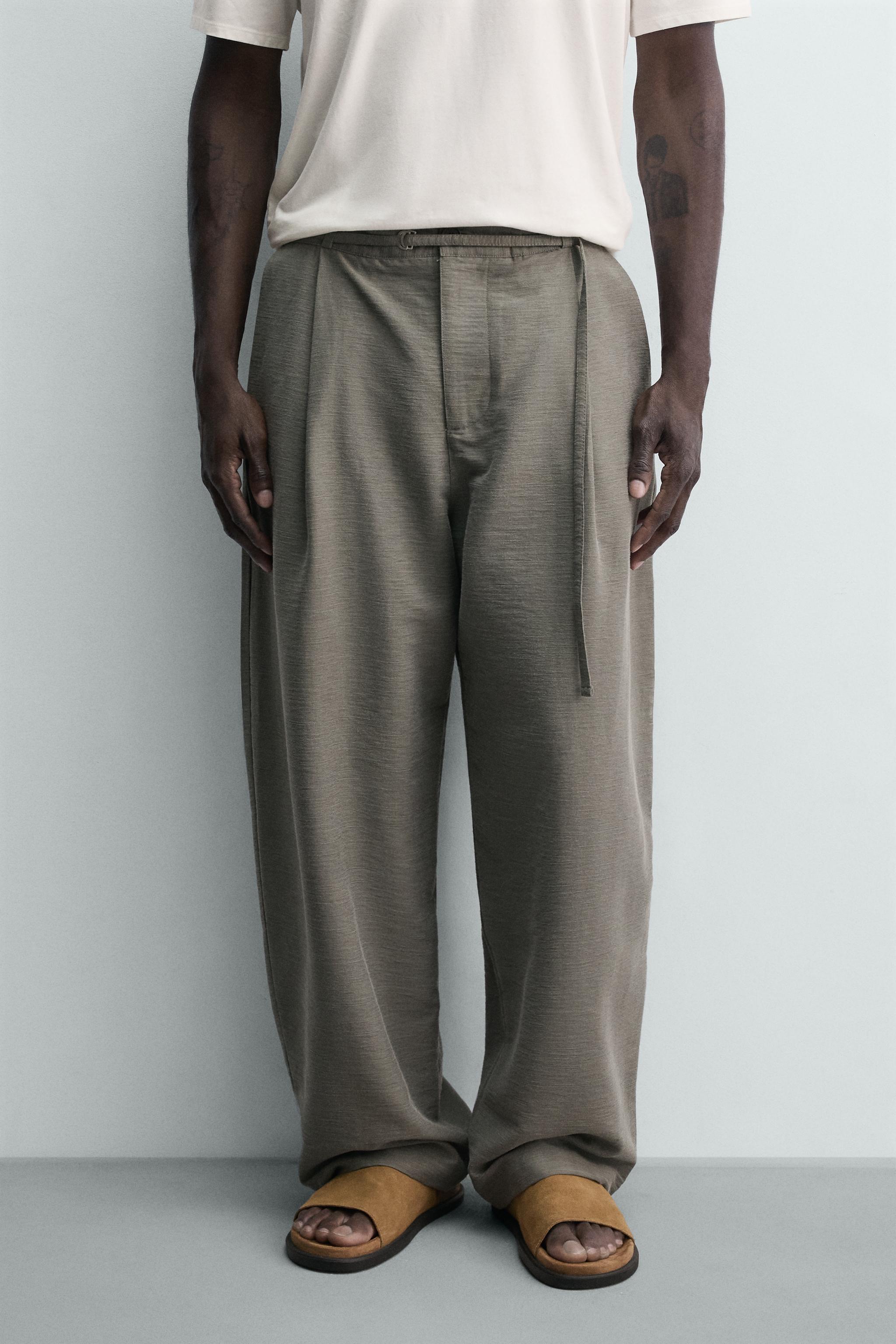 BALLOON FIT PLEATED BELTED PANTS